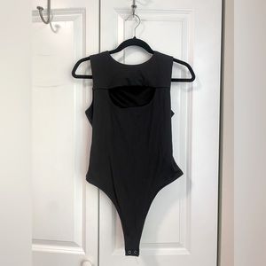 Forever 21 cutout keyhole thong bodysuit. Skims type material size m